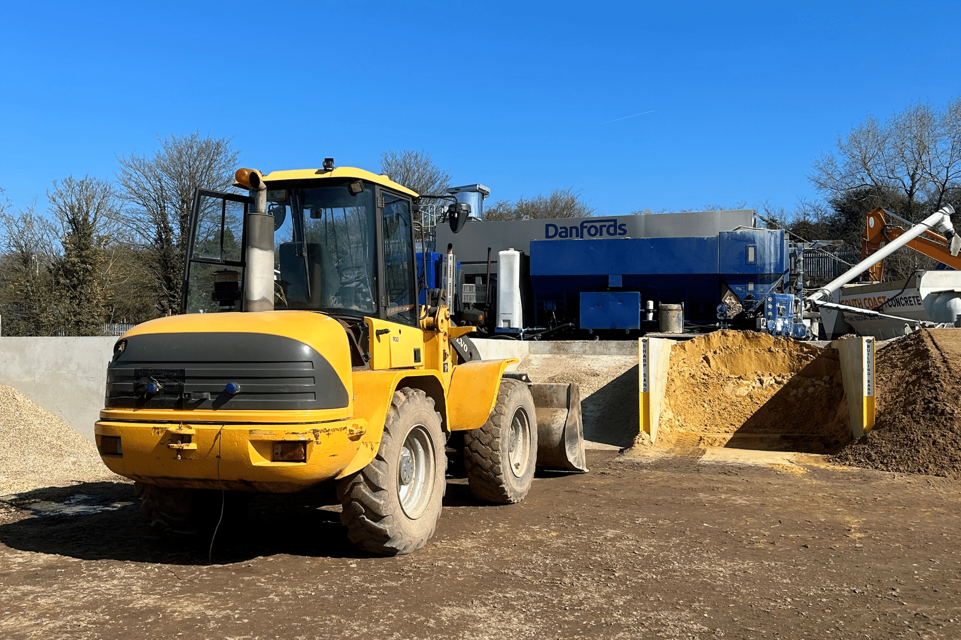 Yellow truck in a yard